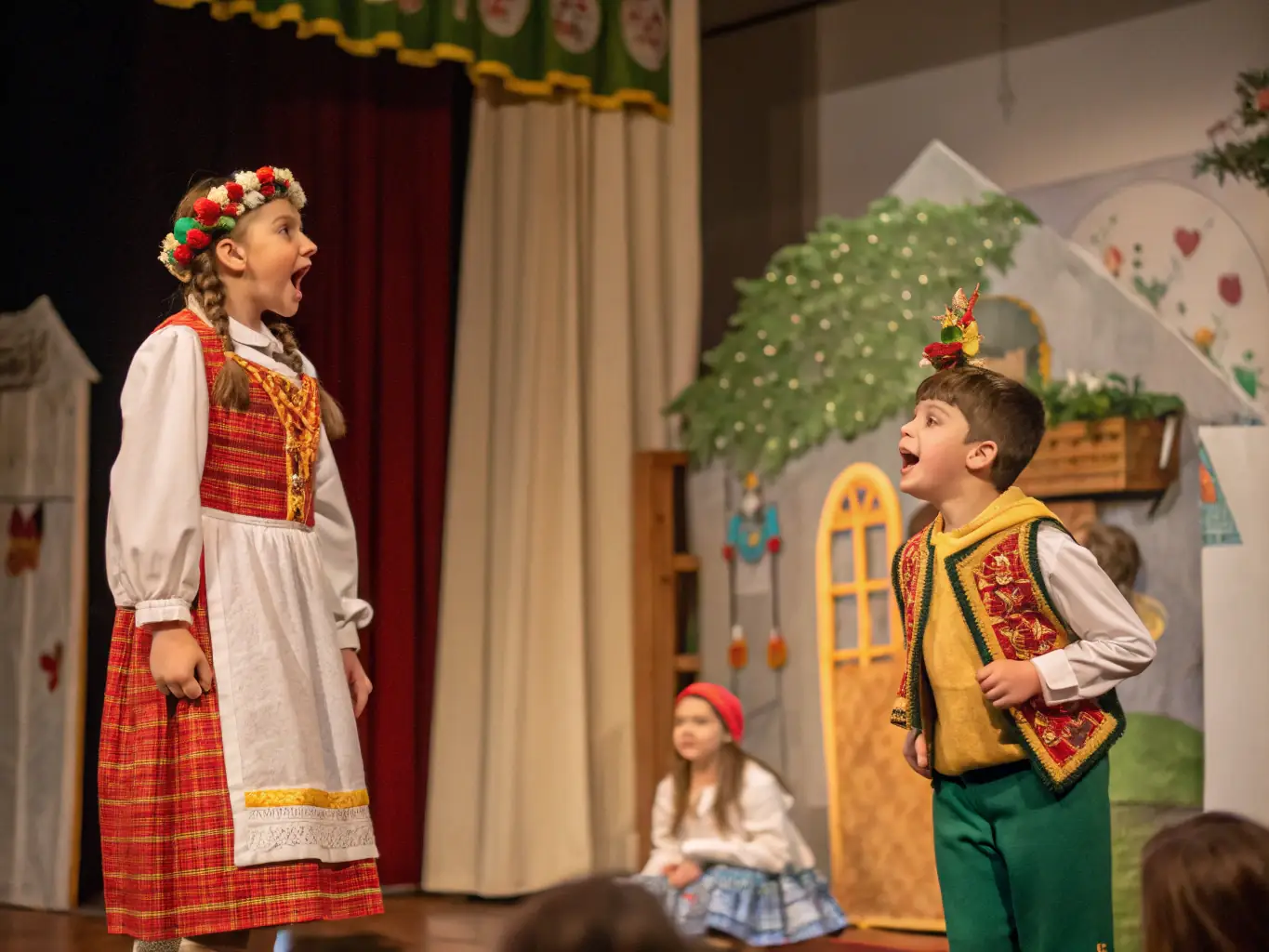 A lively scene of children in colorful costumes acting out a scene on stage, with expressive faces and dramatic lighting, evoking the excitement of a youth theater class at a performing arts school.